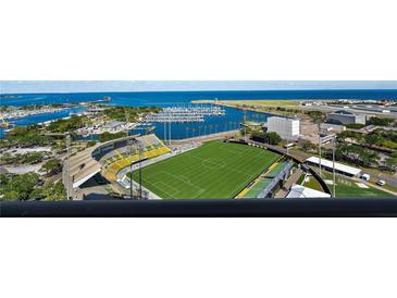 Breathtaking aerial view of a city stadium, marina, and waterfront, showcasing the prime location and waterfront access at 301 1St Street S # 1901, St Petersburg, FL 33701