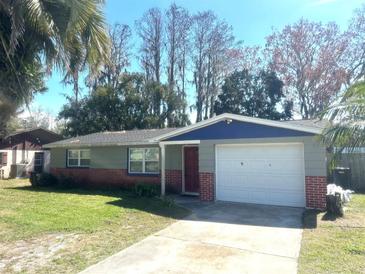 Charming single-Gathering home with a well-maintained lawn and a two-car garage at 6926 Echo Lake Dr, New Port Richey, FL 34653