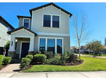 Charming two-story home featuring a beautifully landscaped front yard and inviting entrance at 3367 Janna Grace Way, Land O Lakes, FL 34638