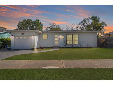 Charming single-story home featuring a manicured lawn, fresh exterior paint, and a welcoming front entrance at 4346 10Th N Ave, St Petersburg, FL 33713