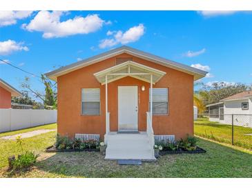 Charming single-story home with a well-manicured lawn and inviting front porch at 6103 Anna Ave, Gibsonton, FL 33534