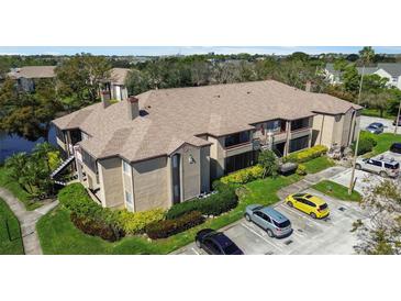 Attractive condo building with well-maintained landscaping, convenient parking, and partial water views from select units at 10265 Gandy N Blvd # 1203, St Petersburg, FL 33702