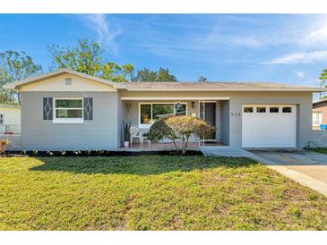 Charming single-story home with gray siding, well-manicured lawn, and attached one car garage at 536 63Rd S Ave, St Petersburg, FL 33705