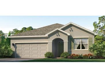 Charming single-story home featuring a neutral color, a two-car garage, and well-maintained landscaping at 17214 Wheatberry Blvd, Parrish, FL 34219