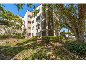 Charming condo building featuring private balconies and mature landscaping at 700 Starkey Rd # 1111, Largo, FL 33771