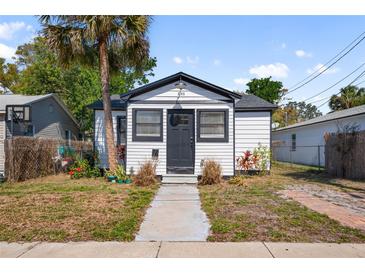 Shot of the bungalow exterior showcases neat landscaping and an inviting walkway at 3765 21St S Ave, St Petersburg, FL 33711