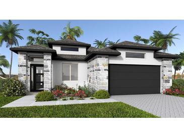 Stunning single-Gathering home featuring stone accents, black trim, lush landscaping and a two car garage at 389 Sun Chaser Dr, Nokomis, FL 34275