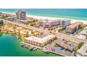 Gorgeous aerial view of beach condo overlooking white sand beach and blue ocean at 4103 Gulf Blvd # 205, St Pete Beach, FL 33706