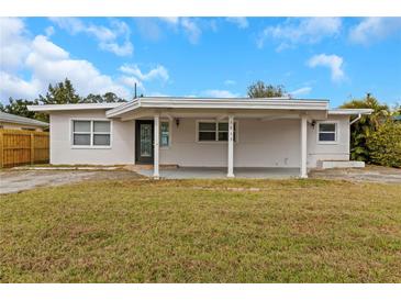 Charming single-story home featuring an open front carport and a well-maintained front lawn at 5813 18Th S Ave, Gulfport, FL 33707