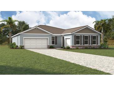 Charming single-story home with a two-car garage and a well-manicured front yard at 11953 Vista Park Ter, Venice, FL 34293