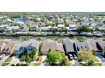 Beautiful aerial view of waterfront homes in a canal community, showcasing stunning architecture and waterfront living at 5709 Sea Turtle Pl, Apollo Beach, FL 33572