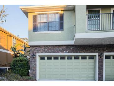 Charming home featuring a stone facade and a two-car garage at 5710 Kingletsound Pl, Lithia, FL 33547