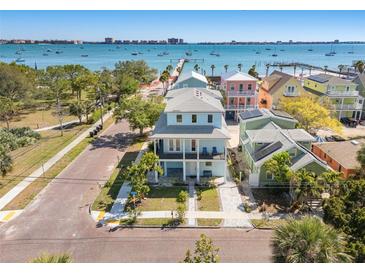 Charming two-story home with double porches in a vibrant neighborhood overlooking the water at 5402 31St S Ave, Gulfport, FL 33707
