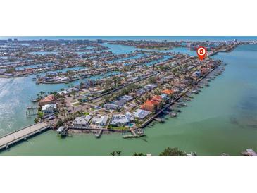 Aerial view of waterfront homes with docks on a sunny day near a bridge at 7998 Causeway N Blvd, St Petersburg, FL 33707