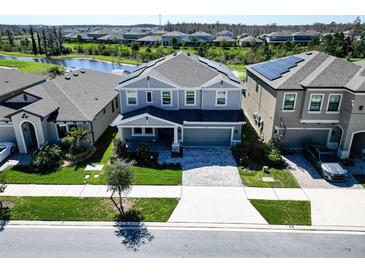 Charming two-story home with landscaped front yard and inviting entrance, showcasing curb appeal at 17802 Everlong Dr, Land O Lakes, FL 34638