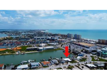 Coastal home on canal featuring nearby beaches, shopping, and dining with waterfront access at 15306 Harbor Dr, Madeira Beach, FL 33708