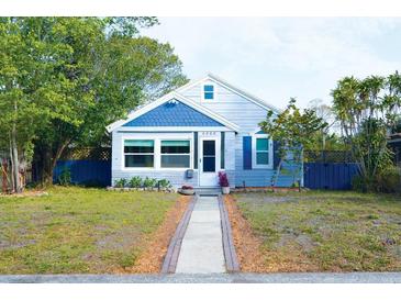 Charming single-story home with blue and white exterior, tidy front yard, and inviting walkway at 4063 10Th N Ave, St Petersburg, FL 33713