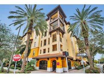 Beautifully designed condo building featuring balconies and a welcoming entrance, surrounded by palm trees at 100 4Th S Ave # 208, St Petersburg, FL 33701