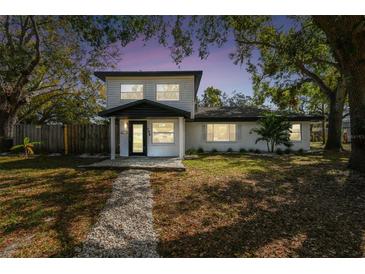 Charming two-story home featuring a well-maintained front yard and modern architectural details at 708 15Th W Ave, Palmetto, FL 34221