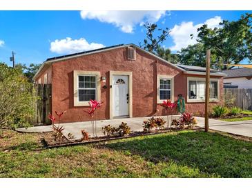 Charming single-story home with colorful landscaping and a quaint, inviting facade on a sunny day at 5613 19Th S Ave, Gulfport, FL 33707