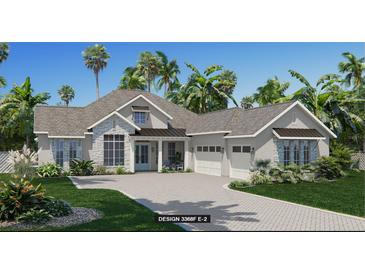 Charming single-story home featuring a paved driveway and lush tropical landscaping at 5837 Creek Ridge Rd, Brooksville, FL 34601