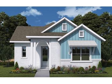 Charming single-story home with blue accents, a well-manicured lawn, and a welcoming entrance at 7263 Kodiak Ln, Sarasota, FL 34240
