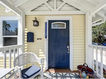 Charming blue front door with decorative window and stylish address numbers at 1137 Highland S St, St Petersburg, FL 33701