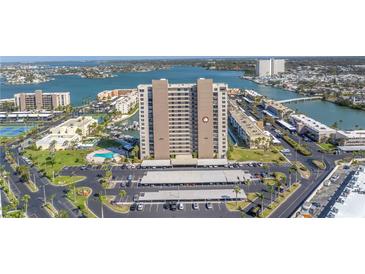 Spectacular aerial view of beachfront high-rise with tennis courts, pool and parking at 7300 Sun Island S Dr # 802, South Pasadena, FL 33707