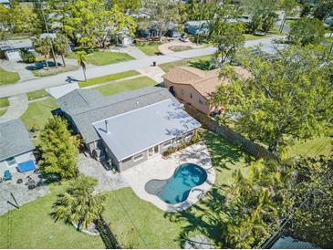 Stunning aerial view of a home with a backyard pool and well-maintained landscaping at 1842 Oklahoma Ne Ave, St Petersburg, FL 33703
