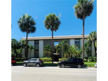 Inviting condo building featuring lush palm trees and well-maintained landscaping on a sunny day at 125 5Th Ne Ave # 240, St Petersburg, FL 33701