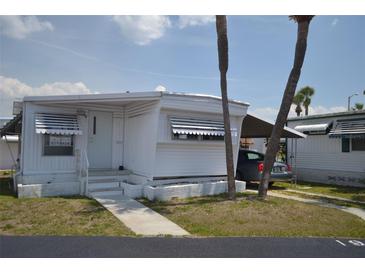 Charming single-story home with a well-maintained lawn and carport; perfect for easy living at 4851 W Gandy Blvd # B5L19, Tampa, FL 33611
