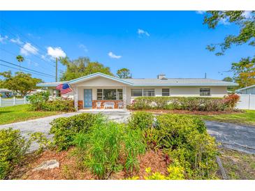 Charming single-story home with a well-maintained front yard and inviting curb appeal on a sunny day at 11601 86Th Ave, Seminole, FL 33772