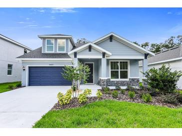 Charming single-Gathering home with a well-manicured lawn and a two-car garage, offering curb appeal at 2497 Orange Harvest Pl, Seffner, FL 33584