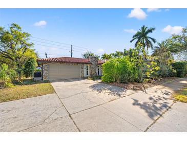 Charming single Gathering home with a stone facade, red tile roof and a two car garage at 360 22Nd Ne Ave, St Petersburg, FL 33704