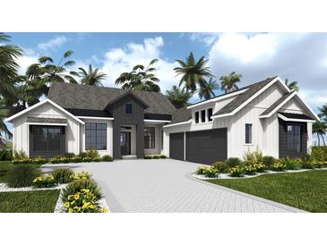 Charming two-story home with gray and white accents, palm trees, and a paver driveway at 5047 Summit View Dr, Brooksville, FL 34601