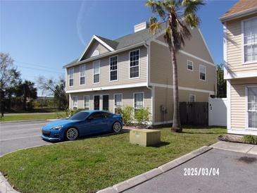 Inviting two-story condo with ample parking, manicured lawn and a mature palm tree at 132 Douglas W Rd # B, Oldsmar, FL 34677