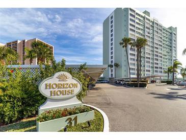 Beautiful high rise with lovely sign, landscaping and convenient covered parking area at 31 Island Way # 106, Clearwater Beach, FL 33767