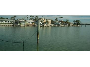 Beautiful waterfront homes with docks and boat lifts offer stunning views and direct access to the water at 780 116Th Ave, Treasure Island, FL 33706