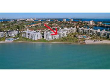 Aerial view of waterfront condo featuring beach access, lush landscaping, and stunning bay views at 6001 Bahia Del Mar Cir # 429, St Petersburg, FL 33715