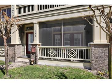 Charming front porch with decorative railing, screened-in area, and inviting entrance at 849 3Rd N St, St Petersburg, FL 33701