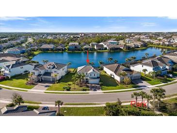 Beautiful waterfront home with mature landscaping and stunning views of the lake and neighborhood at 3248 Anchor Bay Trl, Bradenton, FL 34211