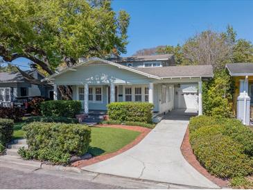 Charming single-story home with a welcoming front porch and well-manicured landscaping at 3007 W Angeles St, Tampa, FL 33629