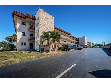Low-rise condominium with parking and exterior walls with unique architectural details at 3010 59Th S St # 314, Gulfport, FL 33707
