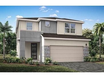 Charming two-story home with a modern design, a garage, and nicely landscaped front yard at 31191 Pendleton Landing Cir, Wesley Chapel, FL 33545