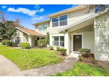 Inviting two-story townhouse with well-manicured lawn and charming curb appeal at 14705 Lake Forest Dr, Lutz, FL 33559