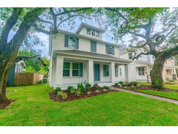 Charming two-story home with landscaped yard and welcoming front porch at 324 37Th Ne Ave, St Petersburg, FL 33704