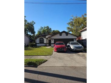 Charming single-story home with a well-maintained lawn and driveway parking at 905 Hart St, Clearwater, FL 33755