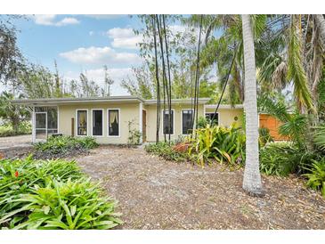 Charming single-story home surrounded by lush landscaping and mature trees offers a serene setting at 3663 Egerton Cir, Sarasota, FL 34233