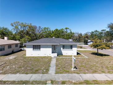 Charming single-story home featuring a well-maintained front yard and sidewalk leading to the front door at 801 37Th S Ave, St Petersburg, FL 33705