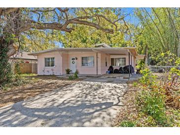 Charming single-story home featuring a covered carport and mature landscaping in a desirable neighborhood at 164 Nw Lincoln N Cir, St Petersburg, FL 33702